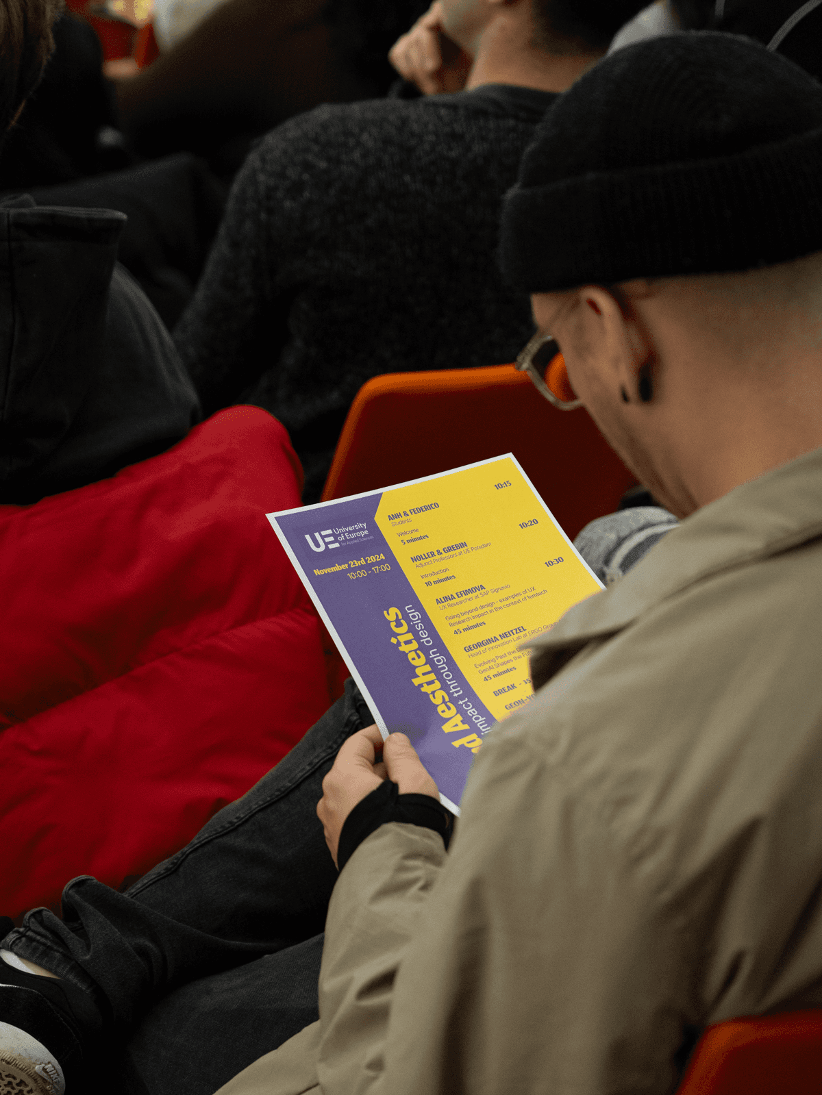 A visitor reading the timetable handout