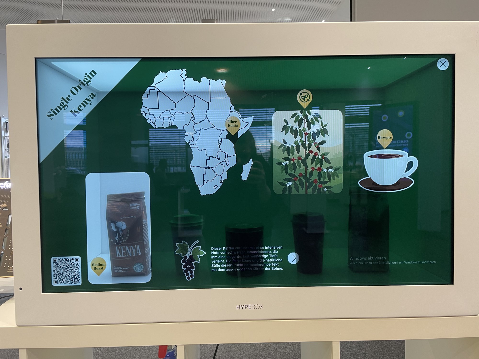 HypeBox showing a map of Africa and a coffee product behind the transparent screen